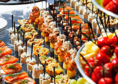 meat, fish, vegetable canapés on a festive wedding table outdoor